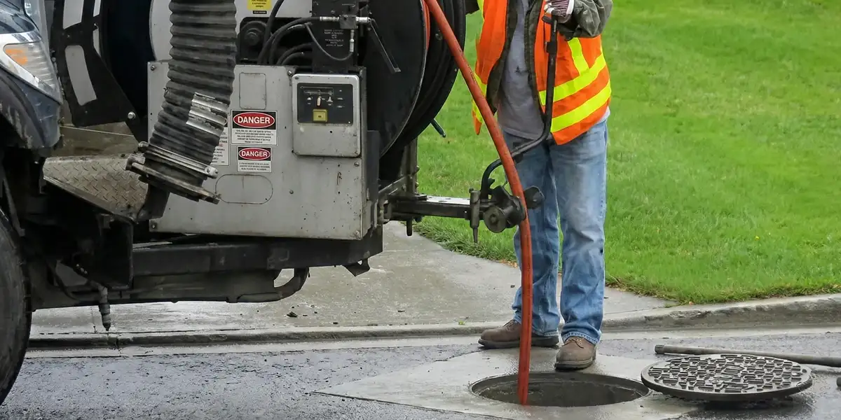 sewage clean up professionals using industrial equipment to remove contaminated wastewater in Sarasota, FL