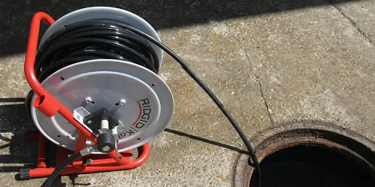 sewer rodding equipment prepared to clear clogged sewer lines in Sarasota, FL